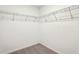 Walk-in closet featuring wire shelving and neutral carpet at 2378 Broadbrook Dr, St Cloud, FL 34771