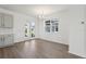 Inviting dining area with hardwood floors, modern chandelier, and access to the backyard at 2378 Broadbrook Dr, St Cloud, FL 34771
