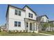 Beautiful two-story home featuring white siding, well-placed windows, and a neatly kept lawn at 2378 Broadbrook Dr, St Cloud, FL 34771