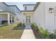 Inviting walkway to the front door, framed by landscaping and manicured lawn at 2378 Broadbrook Dr, St Cloud, FL 34771