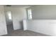 Bright upstairs hallway featuring white walls and neutral carpet at 2378 Broadbrook Dr, Saint Cloud, FL 34771