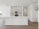 Contemporary kitchen featuring a large island, stainless steel appliances, and elegant gray cabinetry at 2378 Broadbrook Dr, St Cloud, FL 34771