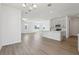 Open concept kitchen and living space featuring hardwood floors and modern finishes at 2378 Broadbrook Dr, St Cloud, FL 34771