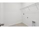 Laundry room with tile flooring, wire shelving, and utility connections at 2378 Broadbrook Dr, St Cloud, FL 34771