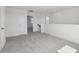 Upstairs loft space with carpet and railing, offering a view of the landing at 2378 Broadbrook Dr, St Cloud, FL 34771