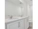 Bright bathroom featuring a double vanity with a large mirror and modern fixtures at 339 Conway Ave, St Cloud, FL 34771