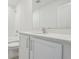 Well-lit bathroom featuring a vanity with a large mirror, tub and modern fixtures at 339 Conway Ave, St Cloud, FL 34771