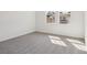 Bedroom with plenty of natural light through two windows and neutral carpet at 339 Conway Ave, St Cloud, FL 34771