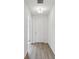 Bright entryway featuring wood-look flooring, a modern light fixture, and white walls for a clean, airy feel at 339 Conway Ave, St Cloud, FL 34771