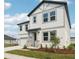 Attractive two-story home featuring a two-car garage, manicured lawn, and appealing architectural details at 339 Conway Ave, St Cloud, FL 34771