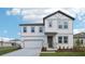 Charming two-story home with a two-car garage, nicely landscaped lawn, and beautiful modern exterior at 339 Conway Ave, St Cloud, FL 34771