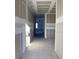 Unfinished hallway with drywall and a glimpse of a window at the end at 339 Conway Ave, Saint Cloud, FL 34771