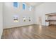 Bright living room with high ceilings and large windows, leading into the kitchen at 339 Conway Ave, St Cloud, FL 34771