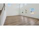Living room featuring high ceilings, large windows, and a staircase at 339 Conway Ave, St Cloud, FL 34771