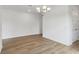 Open-concept living room featuring stylish floors, white walls, and abundant space, perfect for gatherings at 339 Conway Ave, St Cloud, FL 34771