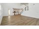 Open-concept living room with a view of the kitchen and staircase at 339 Conway Ave, St Cloud, FL 34771