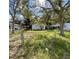 House with a large front yard and mature trees at 3434 Avenue T Nw, Winter Haven, FL 33881