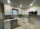 Modern kitchen featuring granite countertops and updated cabinetry at 3434 Avenue T Nw, Winter Haven, FL 33881