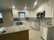 Renovated kitchen featuring granite island and new appliances at 3434 Avenue T Nw, Winter Haven, FL 33881