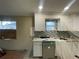 New kitchen with white cabinets and mosaic backsplash at 3434 Avenue T Nw, Winter Haven, FL 33881