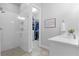 Bathroom featuring frameless shower, white subway tile and walk in closet at 9133 Smithies St, Orlando, FL 32827