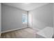 Cozy bedroom featuring neutral walls, carpet flooring, and a window with natural light at 9133 Smithies St, Orlando, FL 32827