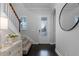 Inviting foyer with wood floors, staircase, and front door with glass insert at 9133 Smithies St, Orlando, FL 32827