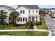 Charming two-story home with a well-manicured lawn, and covered front porch at 9133 Smithies St, Orlando, FL 32827