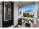 Inviting front porch with seating area and view of the neighborhood at 9133 Smithies St, Orlando, FL 32827