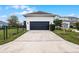 Detached garage with a dark-colored door, offering extra storage space at 9133 Smithies St, Orlando, FL 32827