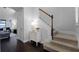 Elegant entry hall with hardwood floors, a staircase, and decorative accents at 9133 Smithies St, Orlando, FL 32827
