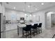 Modern kitchen featuring granite countertops, stainless steel appliances, and a center island at 9133 Smithies St, Orlando, FL 32827