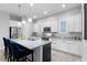 Modern kitchen featuring granite countertops, stainless steel appliances, and a center island at 9133 Smithies St, Orlando, FL 32827