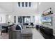 Bright and airy living room featuring a high ceiling, comfortable seating, and hardwood floors at 9133 Smithies St, Orlando, FL 32827