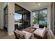 Inviting screened-in patio with upscale outdoor seating and a view of the backyard at 9133 Smithies St, Orlando, FL 32827