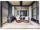 Relaxing screened patio with a grill, cozy seating, and stylish cushions at 9133 Smithies St, Orlando, FL 32827