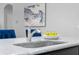 Close up of a kitchen island sink with granite countertops and stainless steel faucet at 9133 Smithies St, Orlando, FL 32827