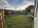 Large backyard with grass and wooden fence at 147 Dahlia Village Cir # Ge, Orlando, FL 32807