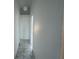 Clean hallway with tile flooring and access to bedrooms at 147 Dahlia Village Cir # Ge, Orlando, FL 32807