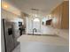 Kitchen boasts stainless steel appliances and light wood cabinets at 147 Dahlia Village Cir # Ge, Orlando, FL 32807