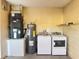 Laundry room with washer, dryer, and water heater at 147 Dahlia Village Cir # Ge, Orlando, FL 32807