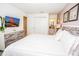 Main bedroom with large bed and en-suite bathroom at 5149 Adelaide Dr, Kissimmee, FL 34746