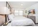 King-size bed, dresser, TV, and bright windows at 5149 Adelaide Dr, Kissimmee, FL 34746
