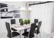 Dining area with white table and black chairs at 5149 Adelaide Dr, Kissimmee, FL 34746