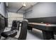 Game room with air hockey and gaming chairs at 5149 Adelaide Dr, Kissimmee, FL 34746