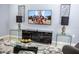 Living Room with black media console and large TV at 5149 Adelaide Dr, Kissimmee, FL 34746