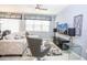 Living Room with light grey sectional sofa and large TV at 5149 Adelaide Dr, Kissimmee, FL 34746