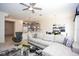Living room with sectional sofa and kitchen view at 5149 Adelaide Dr, Kissimmee, FL 34746
