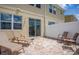 Small patio with sliding glass doors leading to the house and two lounge chairs at 5149 Adelaide Dr, Kissimmee, FL 34746