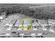 An aerial view outlines a well-kept single-Gathering home with neat landscaping and a brick driveway at 7409 Wing Span Way, Harmony, FL 34773
